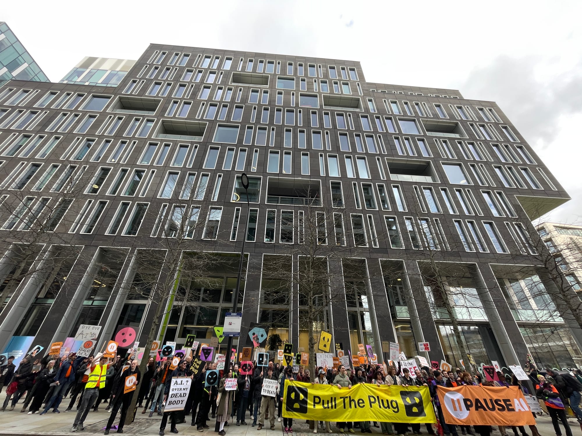People with PauseAI and Pull the Plug banners at an AI protest in London